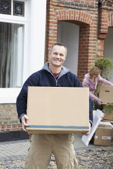 Unpacking boxes in a new home after local removals in Gipsyhill
